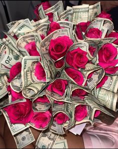 a bunch of roses that are on top of each other with money in the background