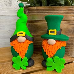 two st patrick's day gnomes sitting next to each other