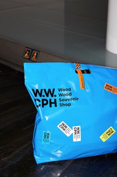 a blue shopping bag sitting on top of a table