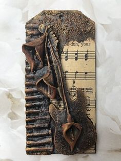 a piece of art that is made out of metal and has music notes on it