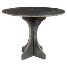 a round table with an iron base on the top, and a circular pedestal in the middle