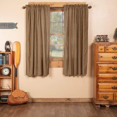 a room with a window, bookshelf and wooden furniture