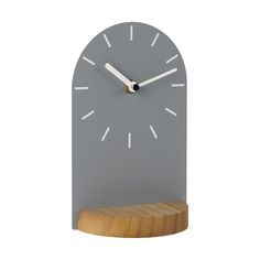 a clock that is on top of a wooden stand