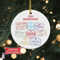 a personalized ornament hanging from a christmas tree