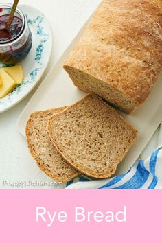 a loaf of rye bread sitting on top of a white plate