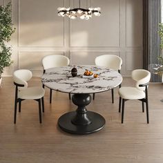 a dining room table with white chairs and a round marble topped table surrounded by potted plants