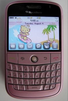 a pink blackberry phone sitting on top of a table