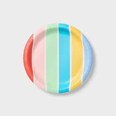 a paper plate with multicolored stripes on it