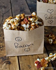 two brown paper bags filled with bacon popcorn