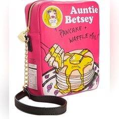 Nwot Betsey Johnson Auntie Betsey Pancake & Waffle Mix Crossbody Shoulder Bag Purse. Betsey Johnson 100% Authentic Rare Find! Style: Kitsch Crossbody Style Name: Auntie Betsey " Pancake & Waffle Mix " Body: Polyurethane Lining: Polyester Long Polyurethane And Gold Toned Chain Shoulder Strap W 25" Drop. Back Bottom Signature Betsey Johnson Name Plate. Top Zipper Closure W Metal Signature Betsey Johnson Lips Zipper Pull. Pink Rose Print Signature Betsey Johnson Polyester Inner Lining. Inside Betsey Johnson Name Plate. 1 Main Inside Compartment Nwot No Issues Measurements: Length 7.5", Height 9", Width 2.5" Novelty Purses, Betsey Johnson Purses, Unique Handbags, Betsey Johnson Handbags, Waffle Mix, Pancake Mix, Novelty Bags, Pink Handbags