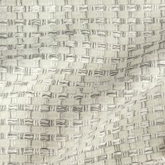 a white and black textured fabric with small squares in the center, as well as lines on it