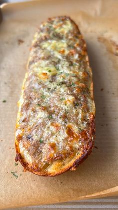 an omelet is sitting on top of a piece of parchment paper