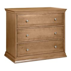 a wooden dresser with three drawers and two pulls on the bottom drawer, against a white background