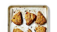 six scones on a baking sheet ready to be baked