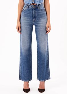 This is a high-rise, wide leg jean, made with a low stretch denim. Fits true to size. The Heidi: Tight around the seat but will soften with wear Features our signature back pocket stitching Specially angled and shaped in the back for a truly peachy looking butt Low stretch denim for a vintage look with the comfort of a stretch Zip closure Made with Rolla's vintage gold hardware The Measurement: Rise: 31 cm / 12 inch Inleg: 83 cm / 32 inch Hem: 49cm / 195 inch *Measurements for size 8 The Wash: S Pocket Stitching, High Rise Denim Jeans, Romper And Jacket, Sweater Tank Top, Classic Jeans, Denim Branding, Denim Design, High Rise Denim, Blue Vintage