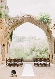 an outdoor ceremony setup with chairs and tables