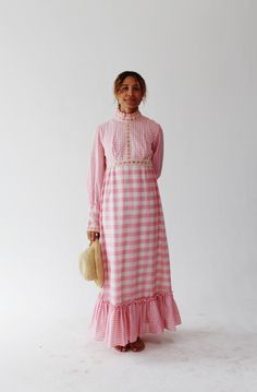 Pink gingham, ruffles and crochet lace?! Be still my heart! This gorgeous maxi dress has dramatic leg o' mutton sleeves and a pink velvet ribbon woven into the crochet lace.  Metal zipper closure. Size tagged 11/12 but please check measurements as this is vintage sizing.  Measures: Bust: 36" Waist: 30" Sleeve: 26" Length: 56" Condition: excellent. FOLLOW US ON INSTAGRAM FOR DEALS AND SNEAK PEEKS! @Wildthingvintage instagram.com/wildthingvintage Twitter: @Wildthingpeck Message me any time for fur Pink Velvet Dress, Pink Gingham Dress, Gorgeous Maxi Dresses, 70s Dress, Vintage Plaid, Pink Gingham, Gingham Dress, Pink Velvet, Velvet Dress