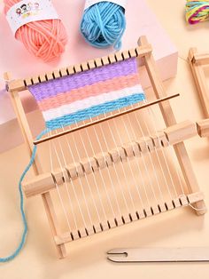 the yarn is being worked on by someone using a knitting machine to weave them together