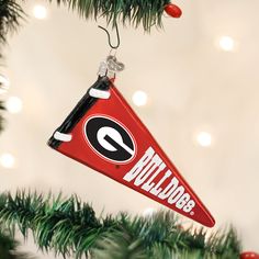 an ornament hanging from a christmas tree with the university of georgia logo on it