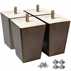 two square wooden boxes with screws and studs on the top one is brown