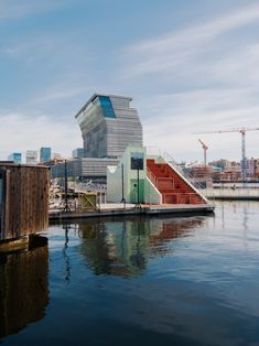 a boat dock with stairs leading up to the building