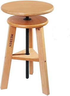 a wooden stool with a screwdriver on the seat and foot rest in front of it