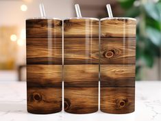 three wooden tumblers sitting on top of a table