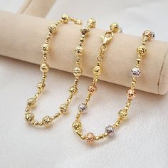 Stunning real 14k white, yellow and rose or plain 14k yellow gold diamond cut bead bracelet. Perfect for everyday and every occasion. Unique, shiny and elegant. This bracelet will make the perfect gift. 14k gold will not tarnish or rust.  Real 14k gold. Not plated, not vermeil. Materials: 14k white, yellow and rose gold Lenght: 7.5 Inches Thickness: - Big bead 5mm  - small bead 2mm Weight: 3.6 grams 14k stamped Brand new For her  Briza Collections is a small family owned business that works hard Gold Bracelets, Solid Gold Jewelry, Gold Plated Bracelets, Small Family, Diamond Cut, Bead Bracelet, Gold Beads, Beaded Chain, Chain Lengths