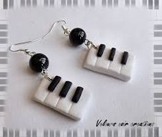 a pair of black and white piano keys earrings