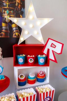 a table topped with red, white and blue cupcakes