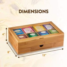 a wooden box with six different types of teas in it and the measurements below