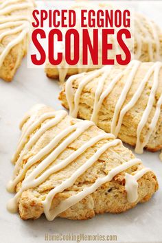 some scones with icing on them sitting on a sheet of paper and the words, spiced eggnog scones