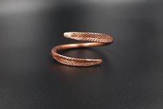 This is an adjustable, massive bracelet made of raw and pure copper.  The Dacian inspiration model symbolizes the ears of wheat. The bracelet is rigid. Circumference between 16-23 cm It can be made to order, any size. Wearing copper jewelry can leave greenish marks on the skin, that can be cleaned with soap and water. Wearing copper jewelry can stimulate healing, especially due to its ability to balance polarities or, in other words, the flow of projective and receptive energies. Nowadays, jewel Copper Jewelry Benefits, Unique Copper Adjustable Bracelets, Copper Bracelet Benefits, Handmade Artistic Copper Bracelet, Electroformed Copper Bangle, 100% Copper Braclet, Thyroid Gland, Wound Healing, Central Nervous System