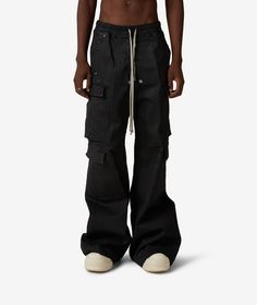 Rick Owens DRKSHDW, known for its dark, avant-garde aesthetic, presents the Double Cargo Jumbo Belas Pants in black.Part of the Fall/Winter 2024 collection, these wide-leg pants are a must-have staple for the season. Made from high-quality materials, they offer both style and comfort. Elevate your wardrobe with these iconic pants from Rick Owens DRKSHDW. Shop now at SVD! Avant Garde Aesthetic, Dark Aesthetics, Stylish Wardrobe, Black Cargo Pants, Rick Owens Drkshdw, Fall Winter 2024, Black Cargo, Winter 2024, 2024 Collection