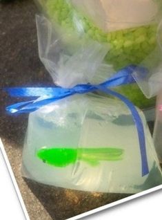 two bags filled with soap sitting next to each other on top of a stone floor