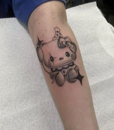 a hello kitty tattoo on the arm