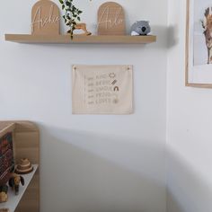 there are two wooden shelves on the wall