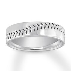 a wedding ring with white gold in the middle