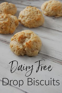 some biscuits are sitting on a table with the words dairy free drop biscuits