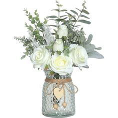 a vase filled with white flowers and greenery