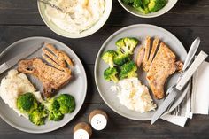 three plates with meat, broccoli and mashed potatoes next to silverware