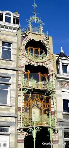 an ornate building with balconies and windows