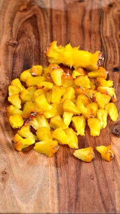 chopped pineapples on a wooden cutting board