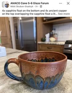 a coffee cup sitting on top of a kitchen counter