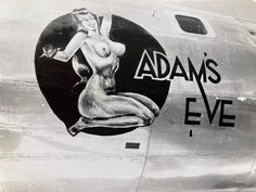 an old photo of a woman painted on the side of a plane's nose