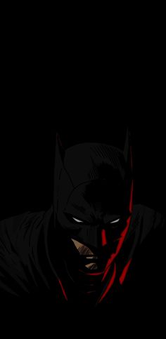 the dark knight in batman's mask with red light on his face and chest