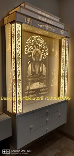 an illuminated buddha statue on display in a room