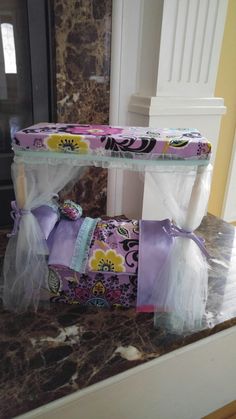 two rolls of toilet paper wrapped in cellophane and sitting on top of a counter