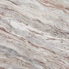 a marble counter top with brown and white colors