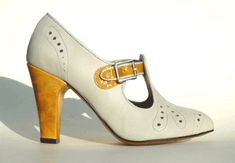 Remix Vintage Shoes, Clouche T-Strap Bootie Heel in Ivory Leather/Yellow Patent Retro Fitted Round Toe Mary Janes, Vintage High Heel Fitted Mary Janes, Vintage Fitted High Heel Mary Janes, Vintage Leather T-strap Mary Janes, Vintage Fitted Leather Mary Janes, Vintage Fitted Mary Janes For Formal Occasions, Retro Fitted Heels With Leather Sole, Retro High Heel Leather Mary Janes, Fitted Brogue Detailed Closed Toe Heels